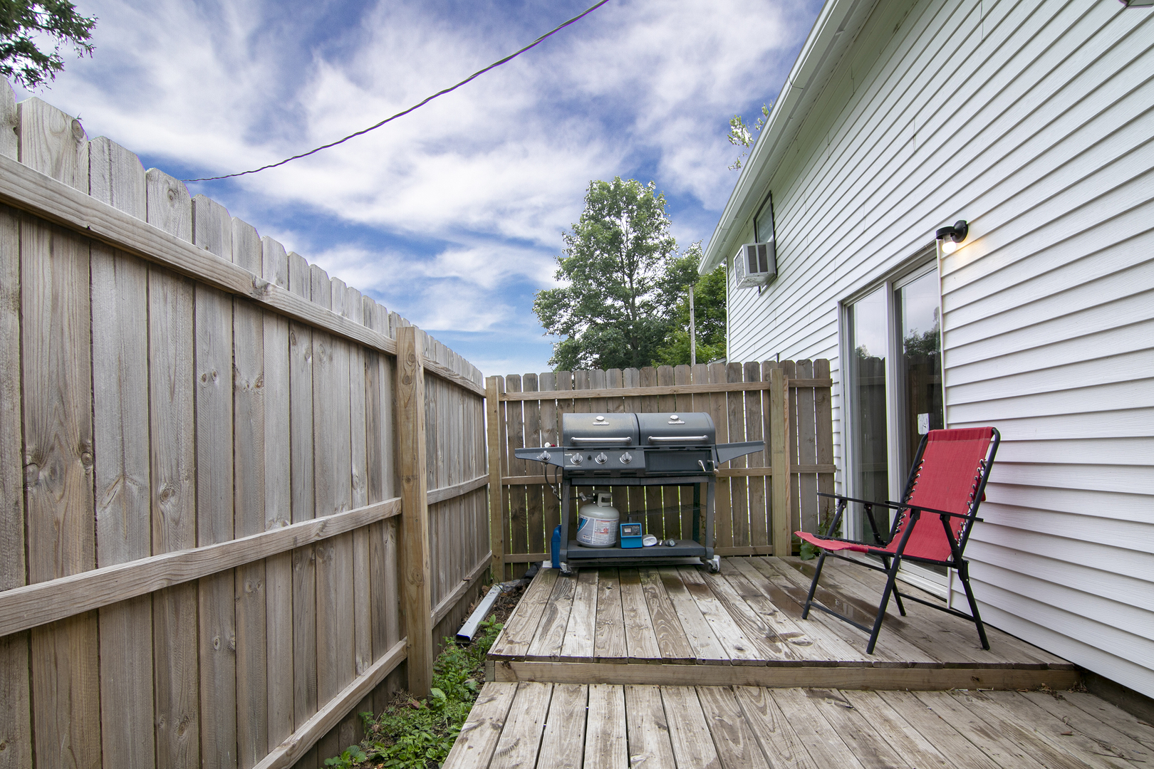 1506 East 2710 North Road Clifton, IL 60927 - Photo 15 of 21 a view of balcony with wooden floor and outdoor seating