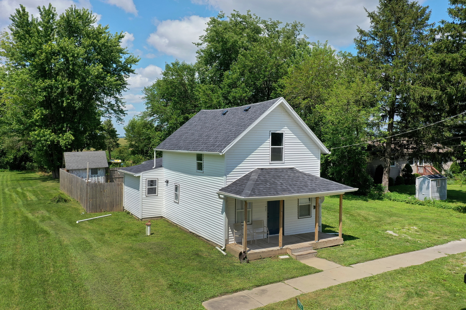 1506 East 2710 North Road Clifton, IL 60927 - Photo 18 of 21 a view of a house with backyard and a garden