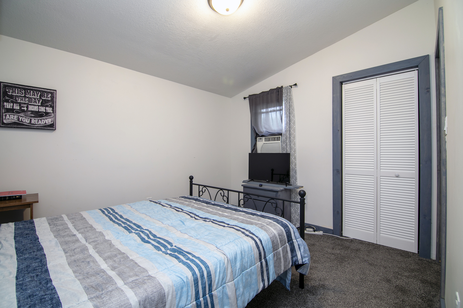 1506 East 2710 North Road Clifton, IL 60927 - Photo 8 of 21 a bedroom with a bed and a tv