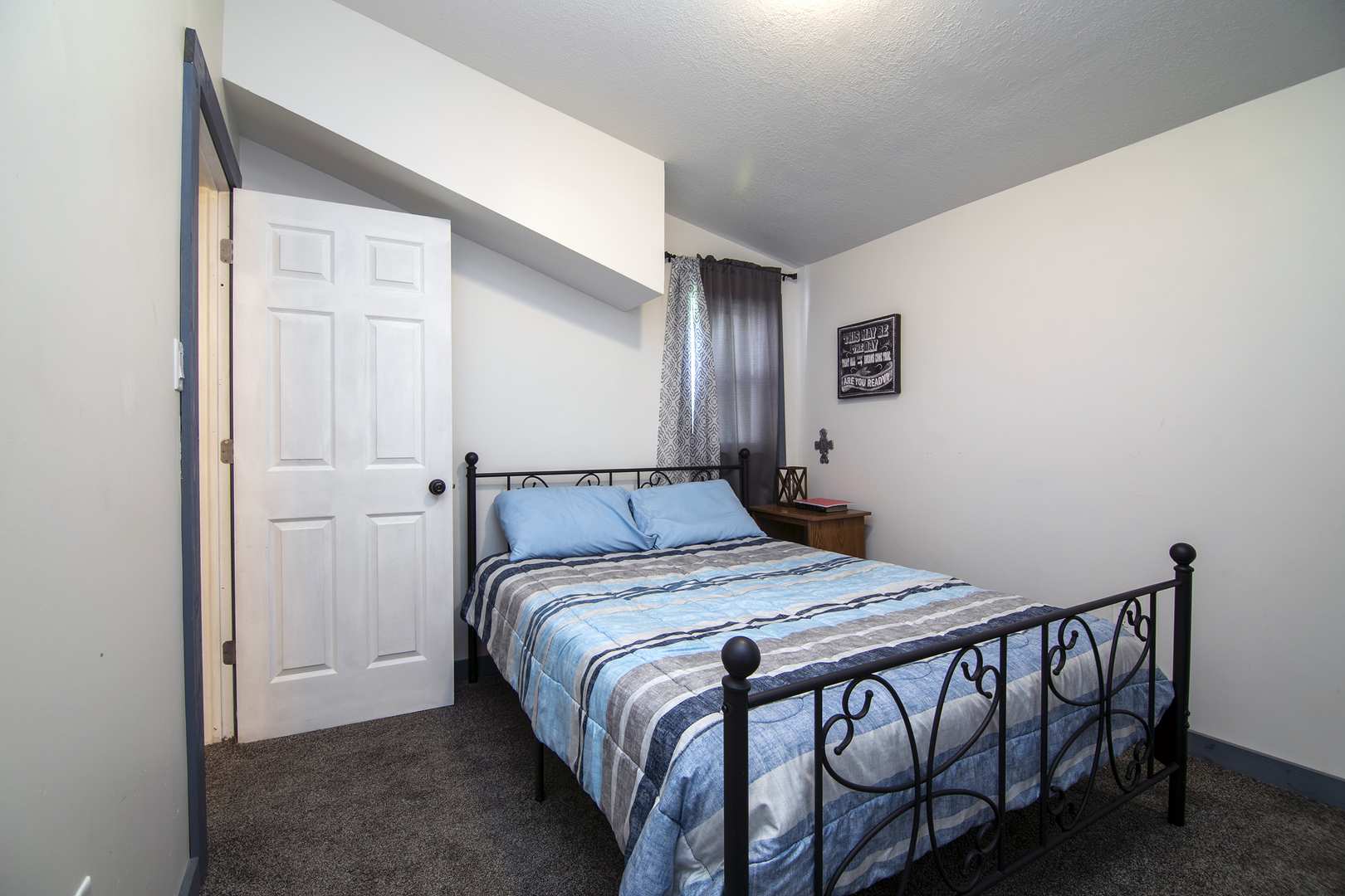 1506 East 2710 North Road Clifton, IL 60927 - Photo 9 of 21 a bedroom with a bed and a table