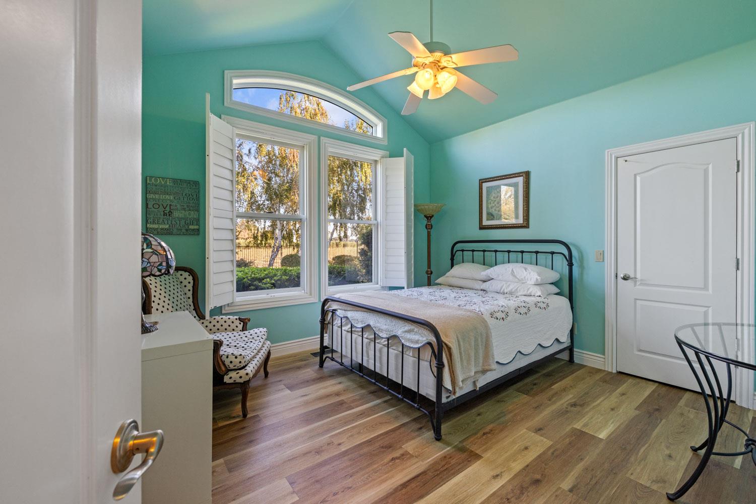5288 West Kile Road Lodi, CA 95242 - Photo 11 of 45 a bedroom with a bed and a large window