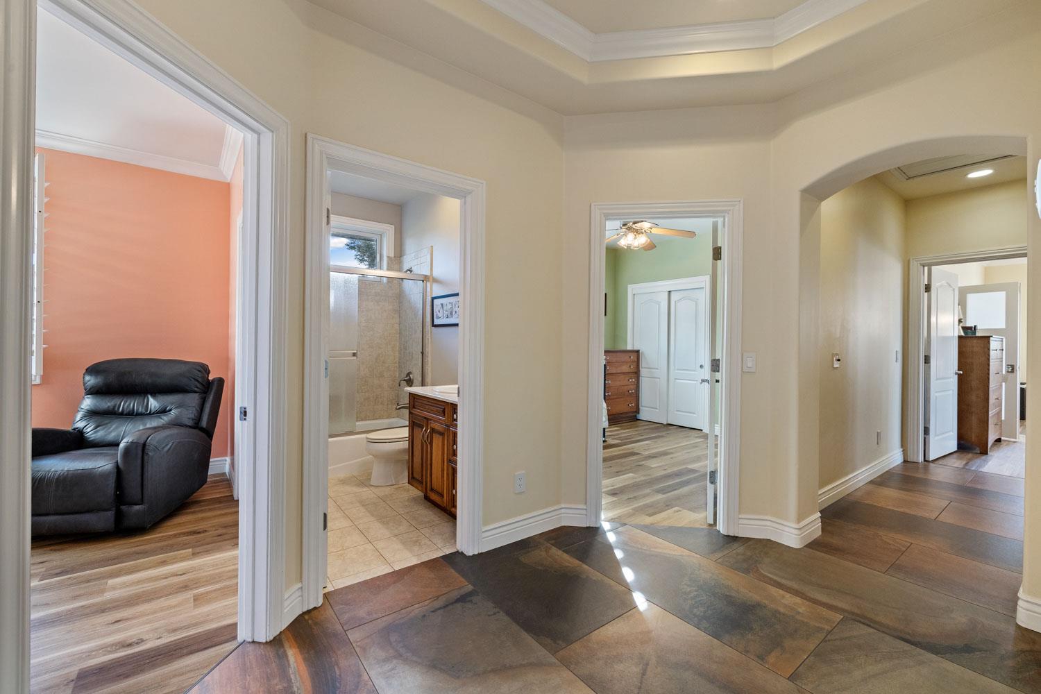 5288 West Kile Road Lodi, CA 95242 - Photo 12 of 45 a view of a hallway view with wooden floor and staircase