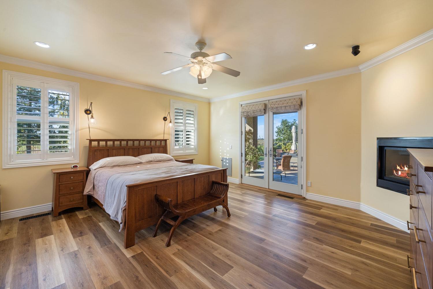 5288 West Kile Road Lodi, CA 95242 - Photo 17 of 45 a spacious bedroom with a bed and a flat screen tv