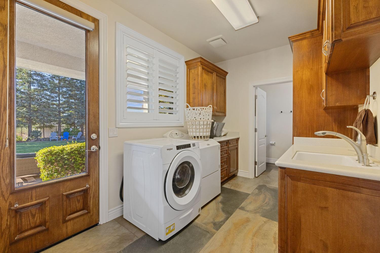 5288 West Kile Road Lodi, CA 95242 - Photo 27 of 45 a utility room with sink dryer and washer