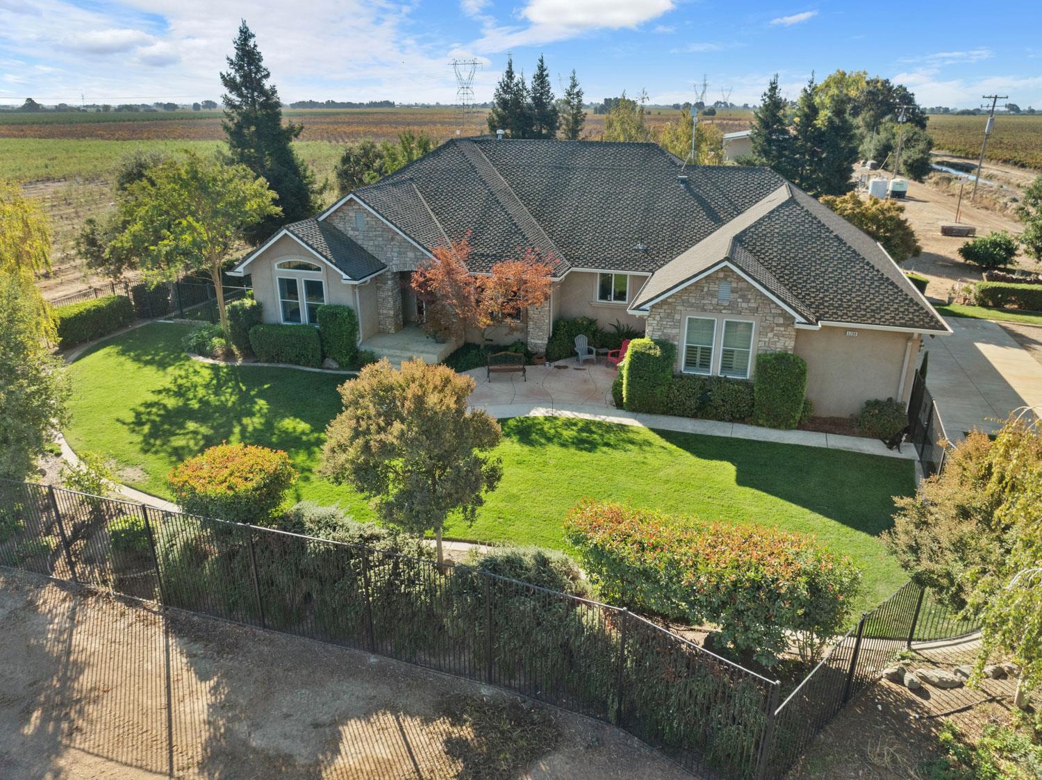 5288 West Kile Road Lodi, CA 95242 - Photo 43 of 45 a house with green field in front of it