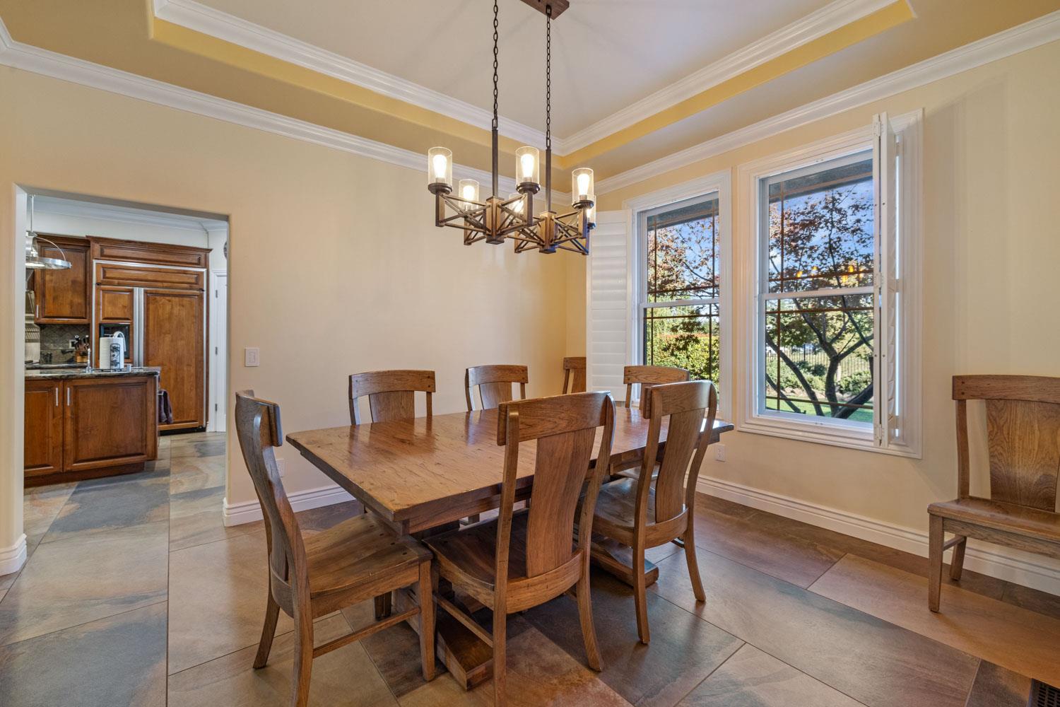 5288 West Kile Road Lodi, CA 95242 - Photo 8 of 45 a view of a dining room with furniture window and wooden floor