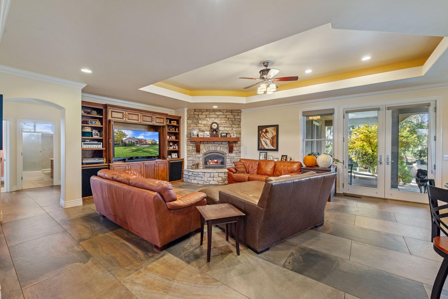 5288 West Kile Road Lodi, CA 95242 - Photo 10 of 45 a living room with furniture and a flat screen tv