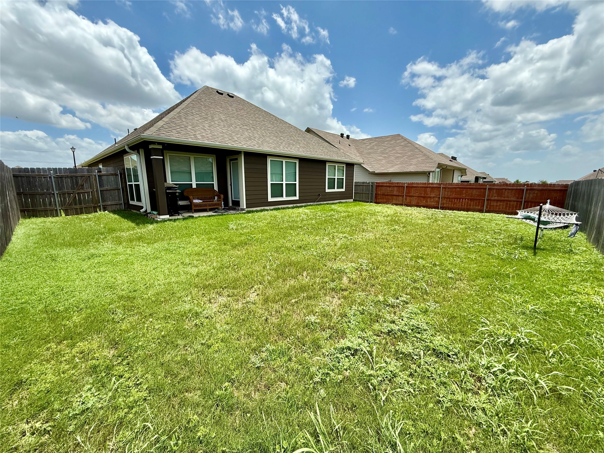 808 Fallbrook Drive Temple, TX 76502 - Photo 31 of 36 Back of property featuring a fenced backyard and a shingled roof