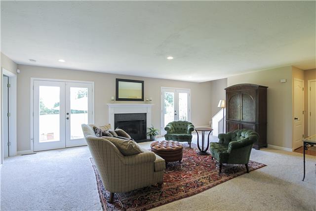 5047 Highpoint Road Pleasant View, TN 37146 - Photo 7 of 20 Large great room-open concept-fireplace-natural light galore-double French Doors out to patio. Great view of kids, pets in play!