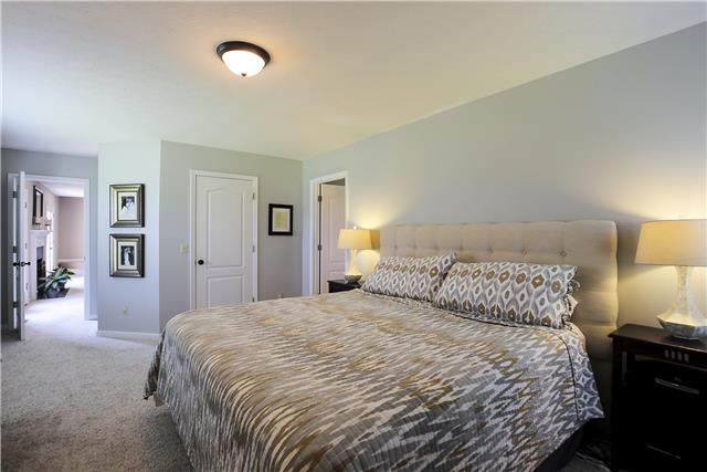 5047 Highpoint Road Pleasant View, TN 37146 - Photo 9 of 20 Master bedroom suite is on the back corner. Features a huge walk in closet-whirlpool tub, separate shower and double vanities. New counter tops in baths.