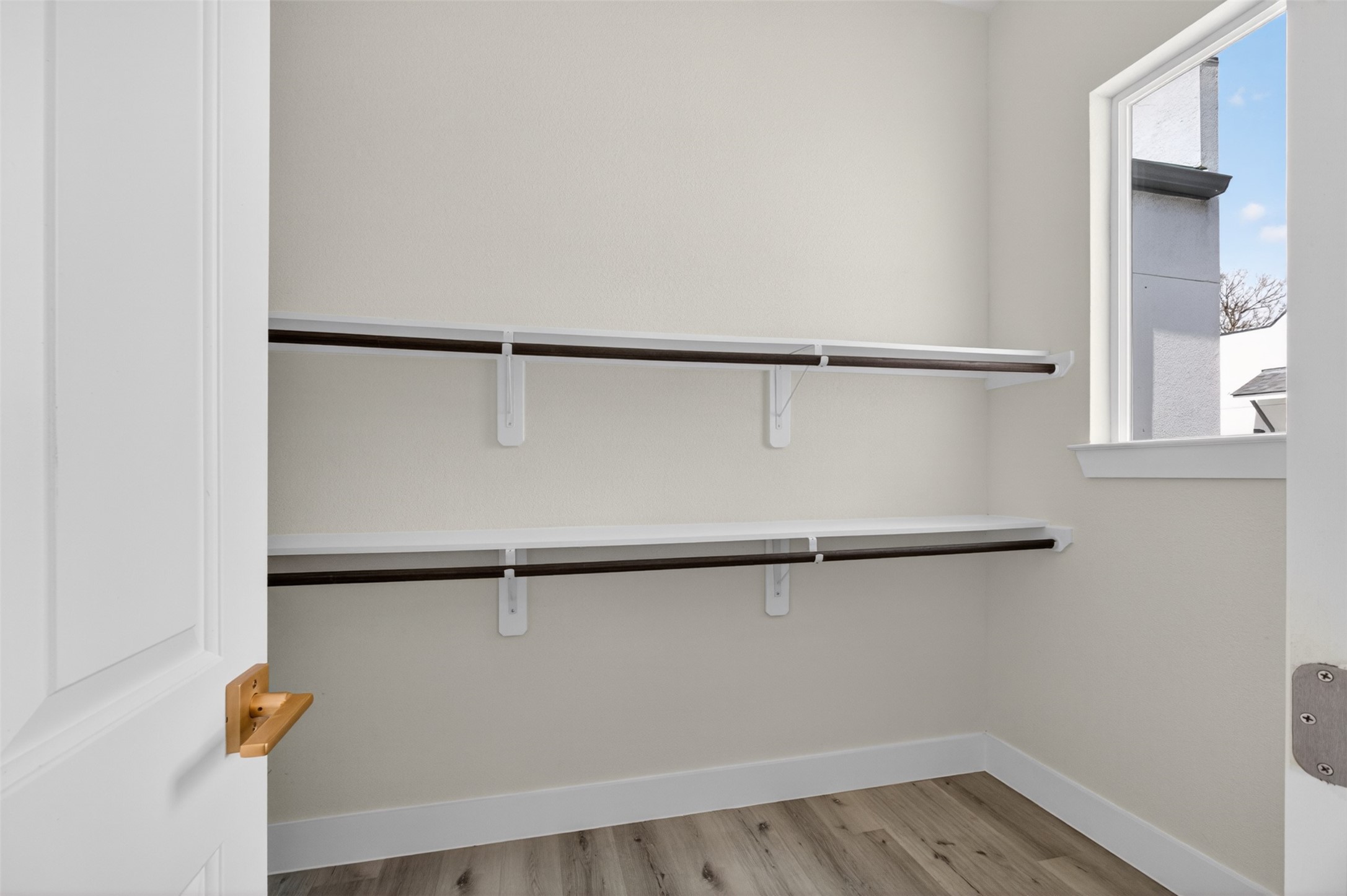 5906 St Augustine Street, Unit F Houston, TX 77021 - Photo 29 of 34 Additional closet with double hanging rods, shelving, and natural light.