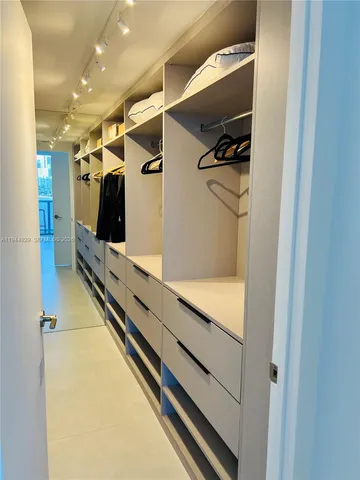 a view of a hallway with closet
