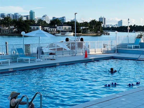 a view of a living room and kitchen
