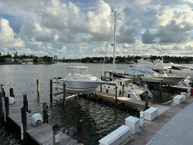 a kitchen with refrigerator and table