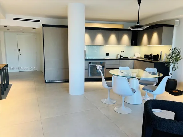 a kitchen with a sink cabinets and stainless steel appliances