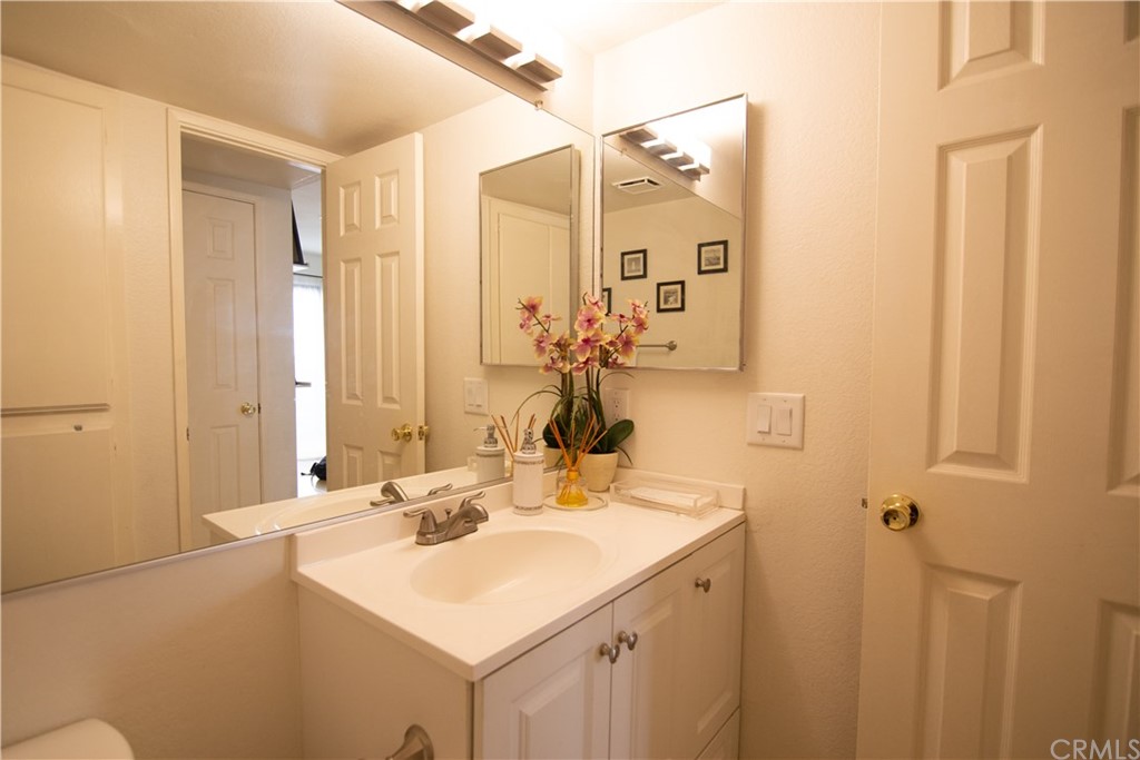 1812 Huntington Drive Duarte, CA 91010 - Photo 11 of 28 a bathroom with a sink vanity and a mirror