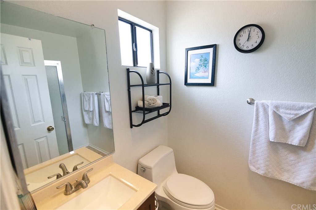 1812 Huntington Drive Duarte, CA 91010 - Photo 20 of 28 a bathroom with a toilet sink and mirror
