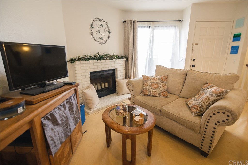 1812 Huntington Drive Duarte, CA 91010 - Photo 7 of 28 a living room with furniture a flat screen tv and a fireplace