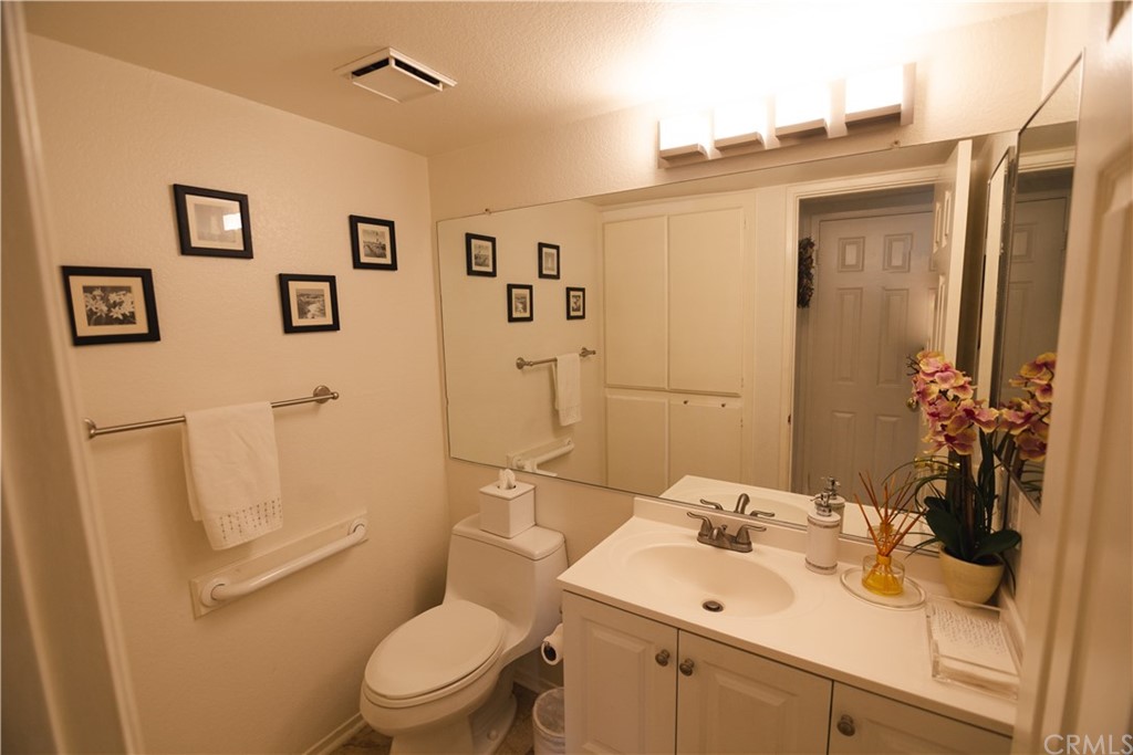 1812 Huntington Drive Duarte, CA 91010 - Photo 10 of 28 a bathroom with a sink mirror vanity and toilet