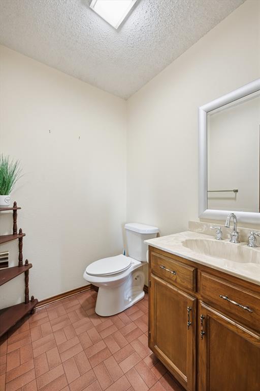 12099 County Road 1028 Blue Ridge, TX 75424 - Photo 19 of 36 a bathroom with a sink and a toilet