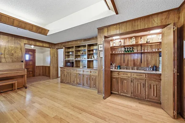 a kitchen with stainless steel appliances granite countertop a stove and cabinets
