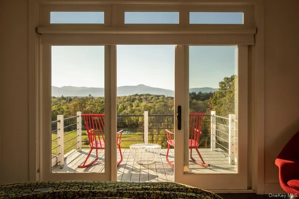 a view of a porch with a floor to ceiling window