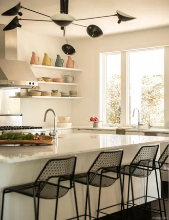 a kitchen with a table and chairs in it
