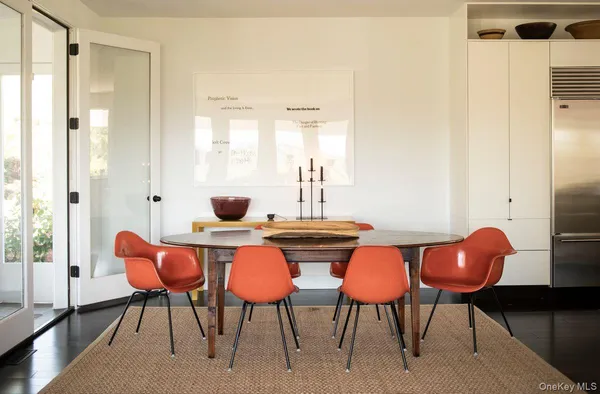 a view of a dining room with furniture and wooden floor