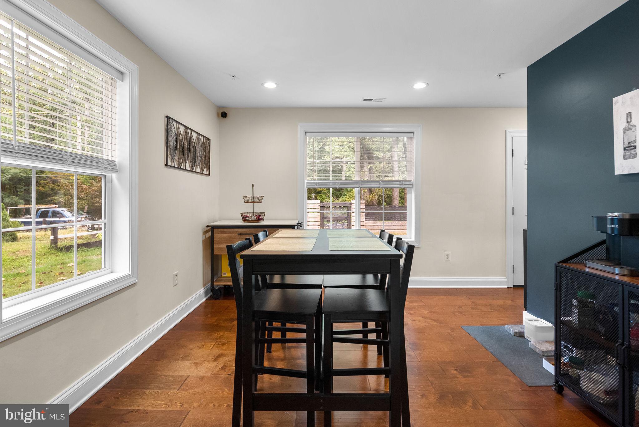 9621 Temple Hill Road Clinton, MD 20735 - Photo 16 of 48 a dining room with a wooden table and chairs
