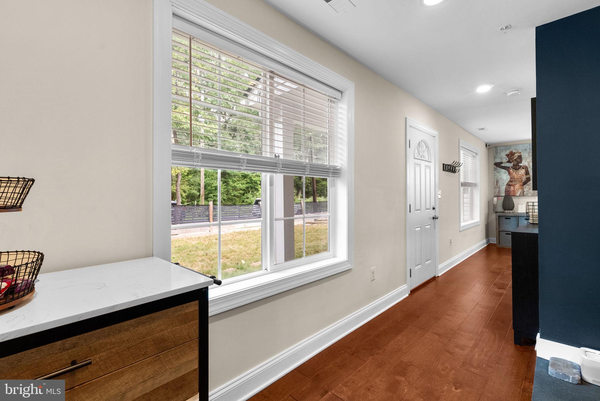 9621 Temple Hill Road Clinton, MD 20735 - Photo 19 of 48 a view of a room with wooden floor and windows