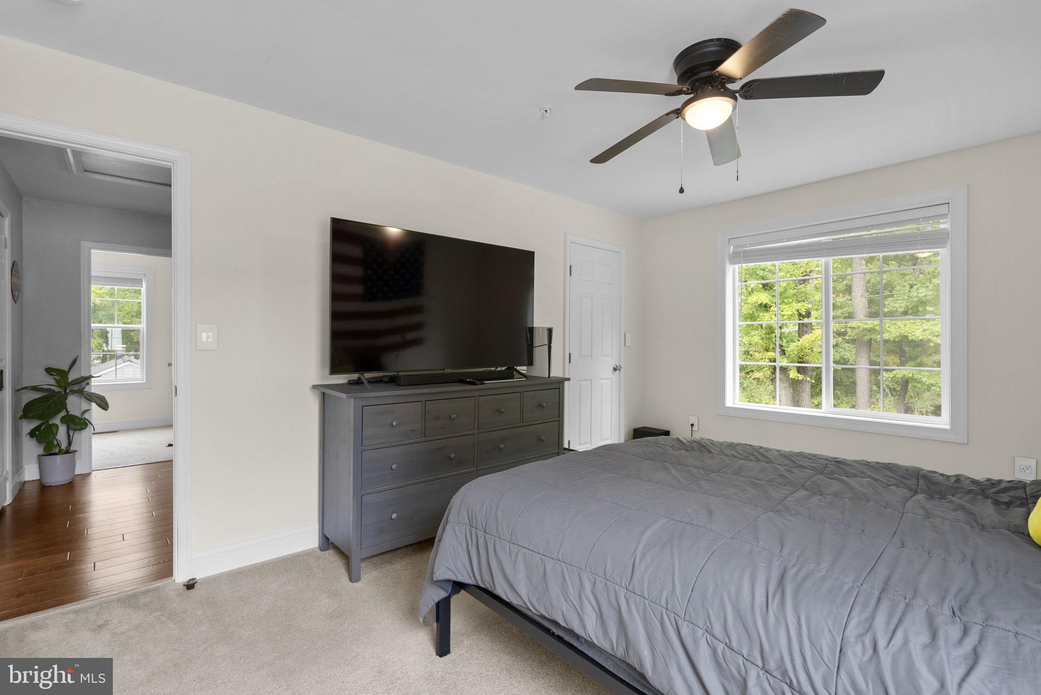 9621 Temple Hill Road Clinton, MD 20735 - Photo 24 of 48 a bedroom with a bed and a flat screen tv