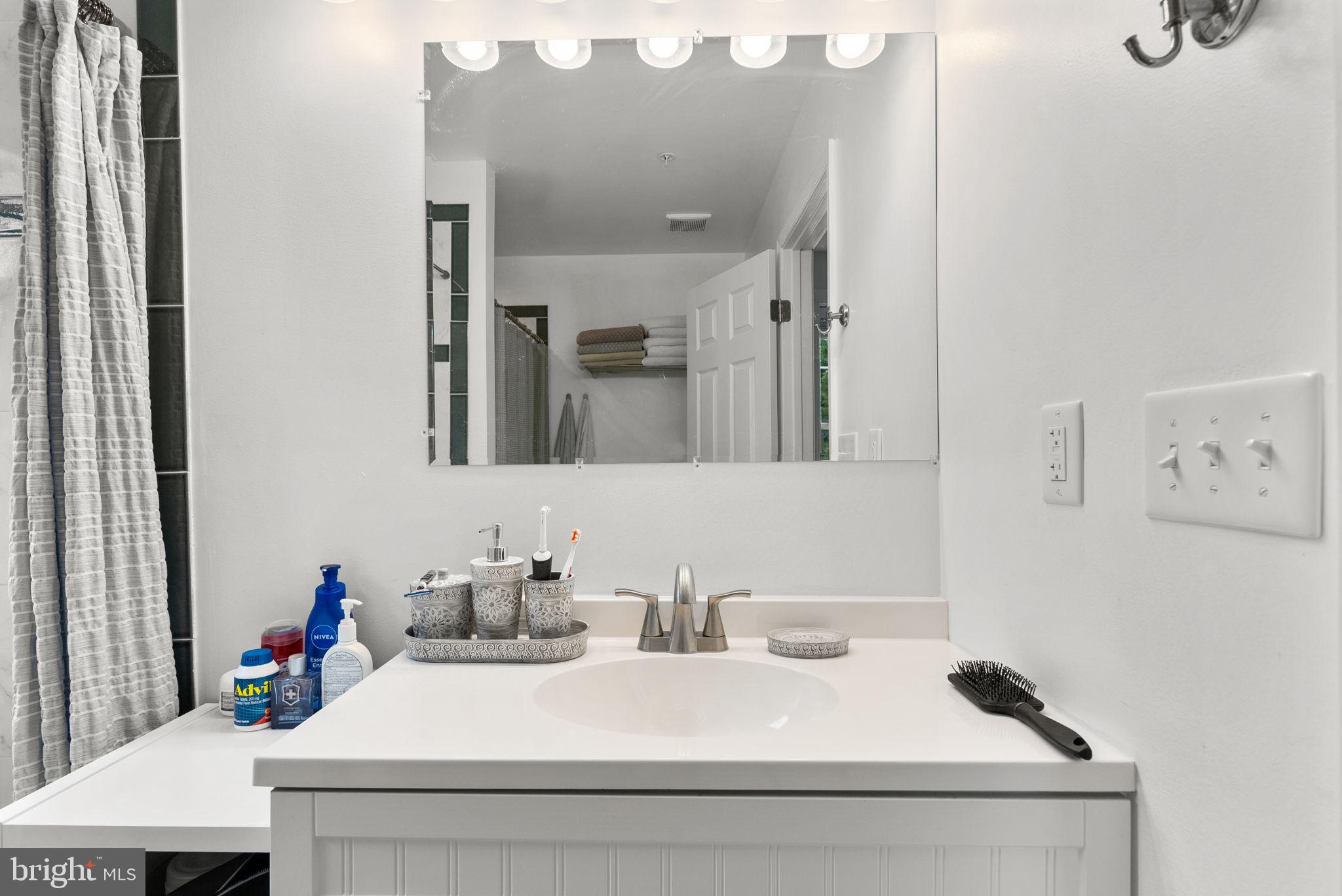 9621 Temple Hill Road Clinton, MD 20735 - Photo 27 of 48 a bathroom with a sink and a mirror