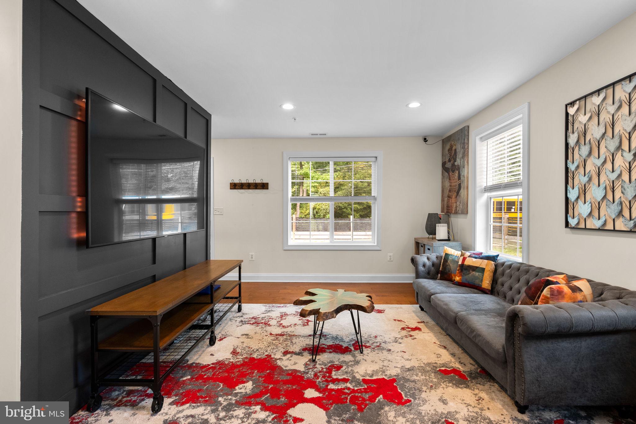 9621 Temple Hill Road Clinton, MD 20735 - Photo 4 of 48 a living room with furniture and a flat screen tv