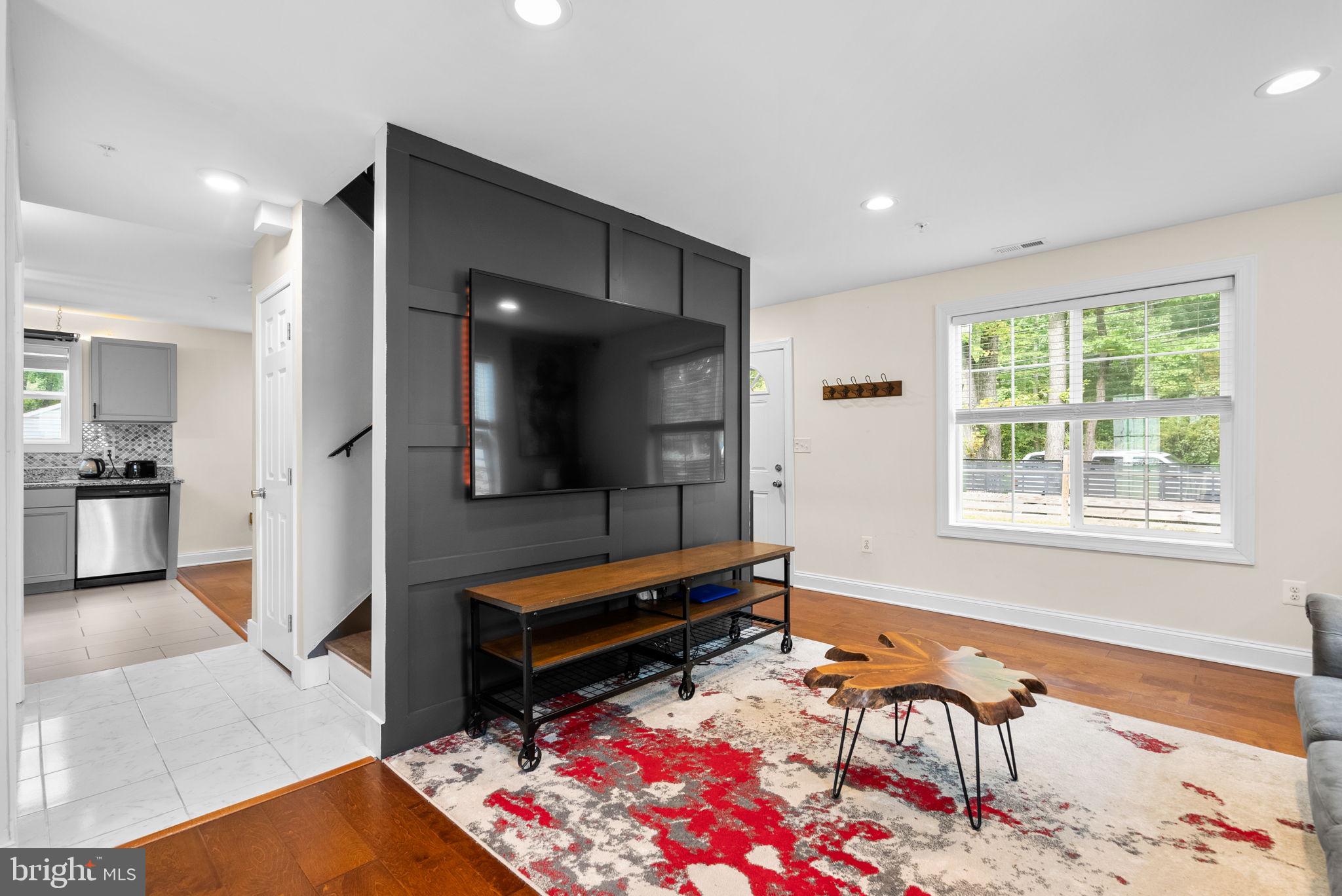 9621 Temple Hill Road Clinton, MD 20735 - Photo 6 of 48 a living room with furniture and a flat screen tv