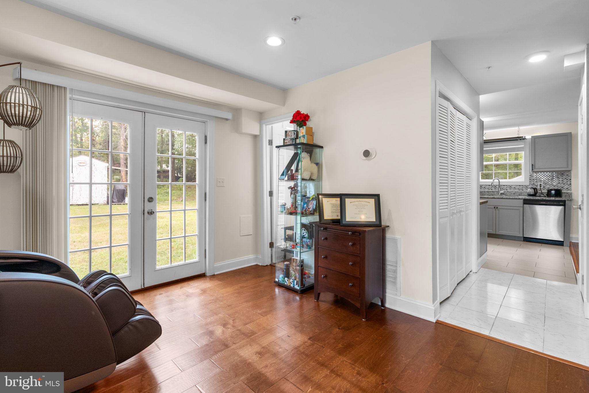 9621 Temple Hill Road Clinton, MD 20735 - Photo 7 of 48 a living room with furniture and a flat screen tv