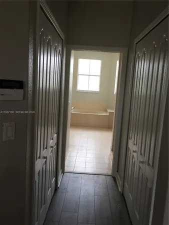 a bathroom with a sink a vanity and a bathtub