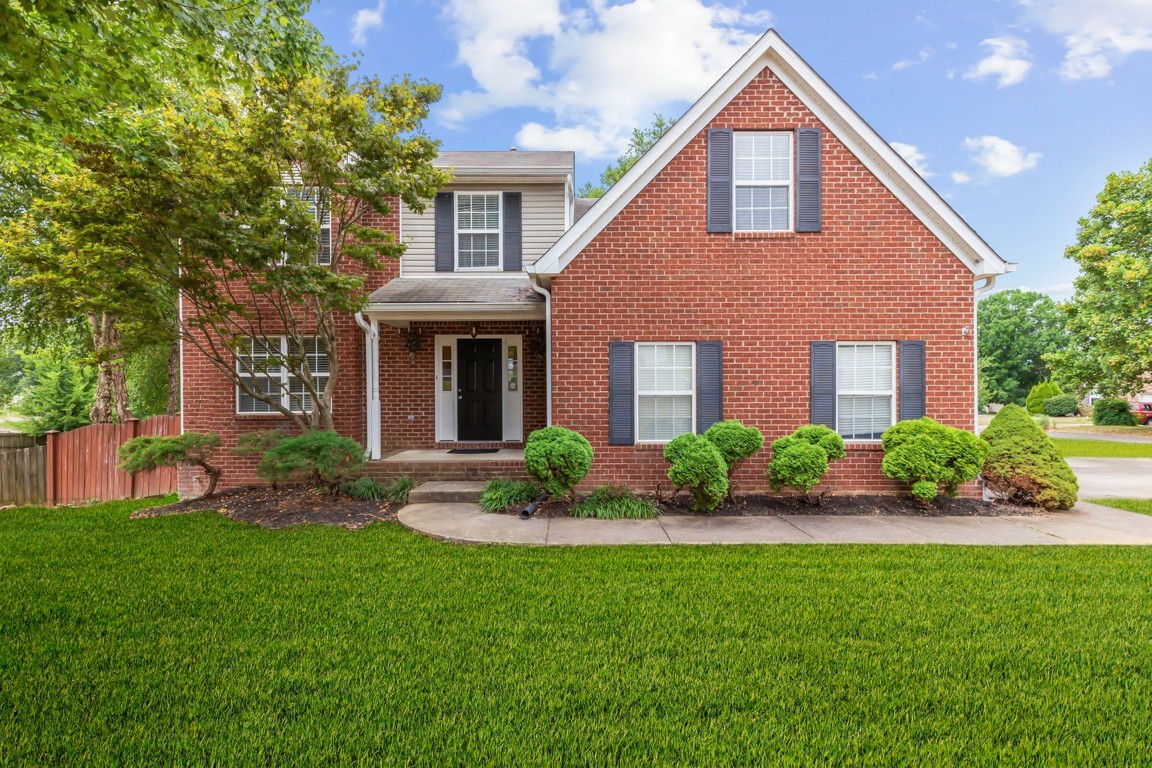 1948 Portway Road Spring Hill, TN 37174 - Photo 1 of 29 a front view of a house with a garden and plants