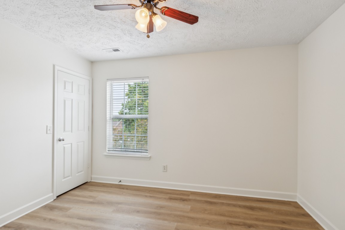 1948 Portway Road Spring Hill, TN 37174 - Photo 17 of 29 an empty room with a window and ceiling fan