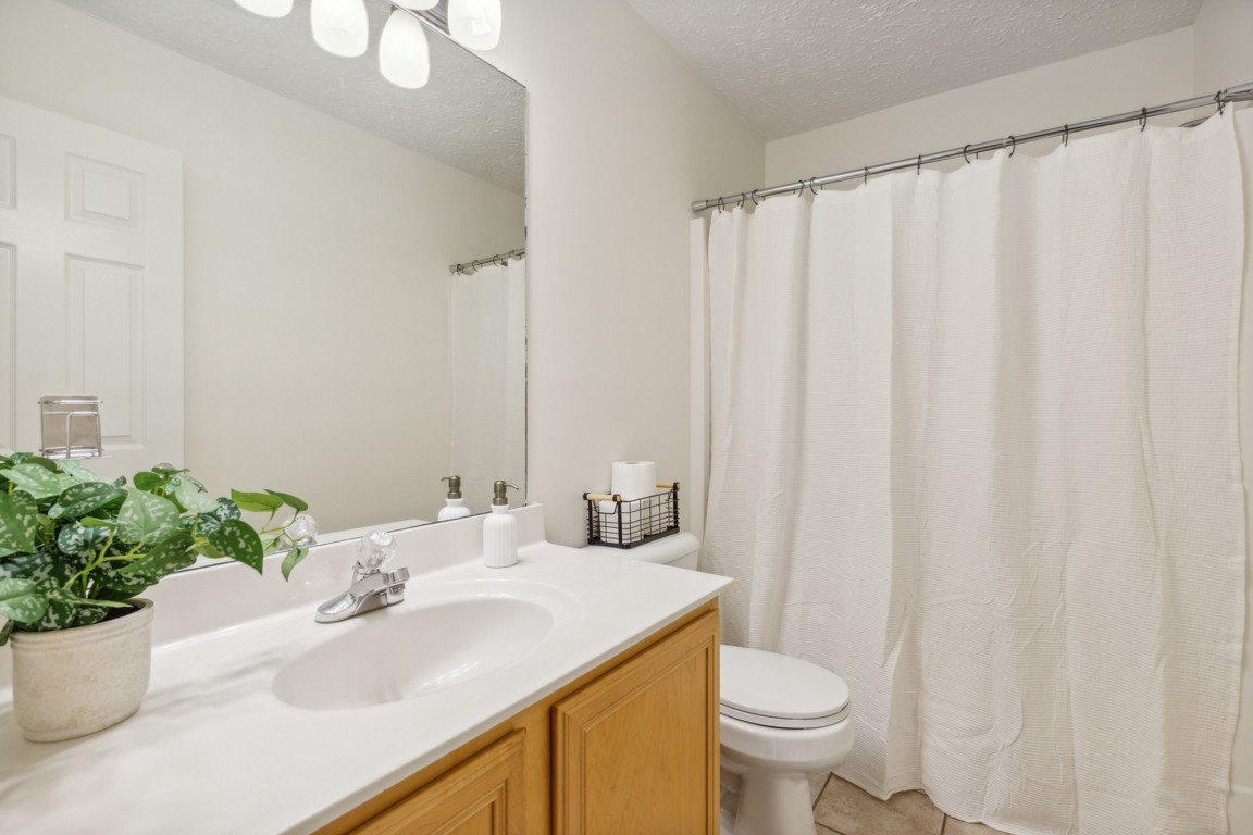 1948 Portway Road Spring Hill, TN 37174 - Photo 18 of 29 a bathroom with a sink toilet and shower