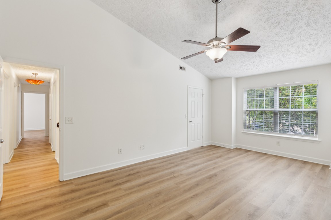 1948 Portway Road Spring Hill, TN 37174 - Photo 21 of 29 a view of an empty room with wooden floor and a window