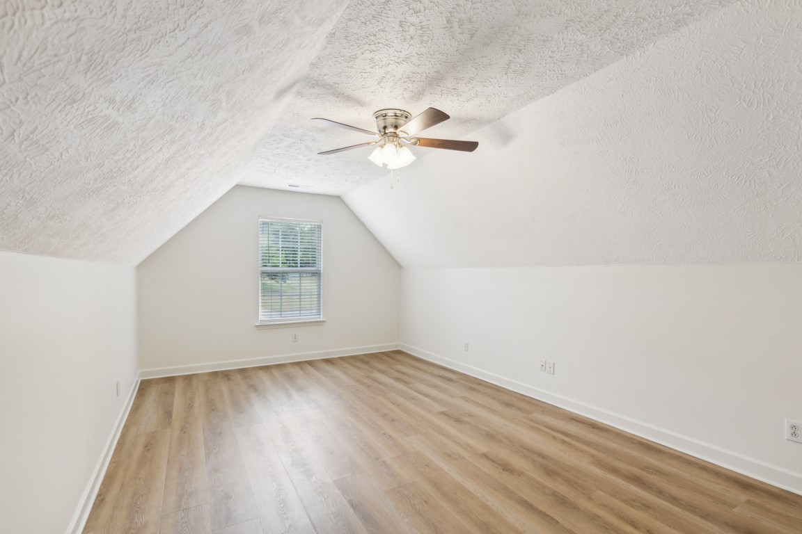 1948 Portway Road Spring Hill, TN 37174 - Photo 26 of 29 an empty room with a window and a ceiling fan