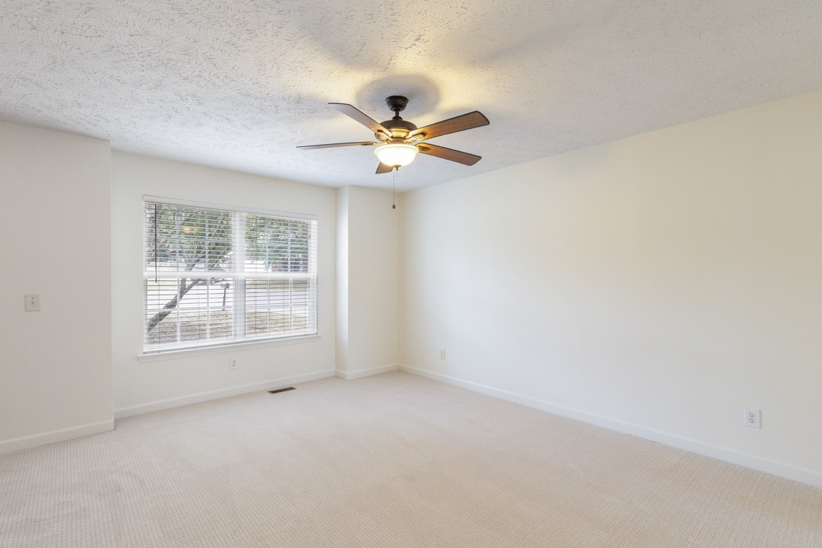 1948 Portway Road Spring Hill, TN 37174 - Photo 4 of 29 an empty room with a window and a fan