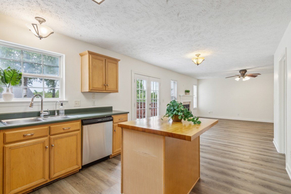 1948 Portway Road Spring Hill, TN 37174 - Photo 9 of 29 a kitchen with stainless steel appliances granite countertop a sink and wooden floor