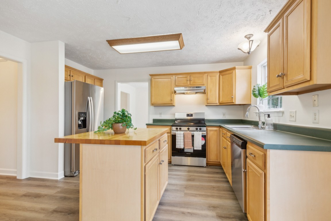 1948 Portway Road Spring Hill, TN 37174 - Photo 10 of 29 a kitchen with stainless steel appliances granite countertop a sink and a stove