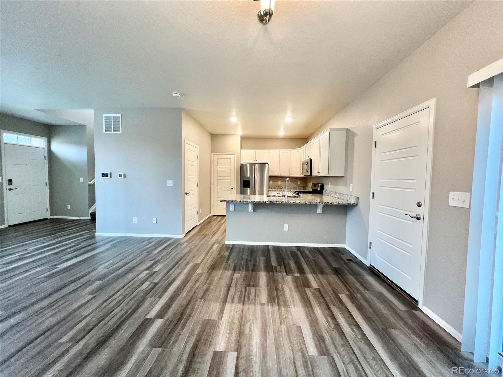 6902 Longpark Drive Parker, CO 80138 - Photo 5 of 18 a view of kitchen with sink and refrigerator