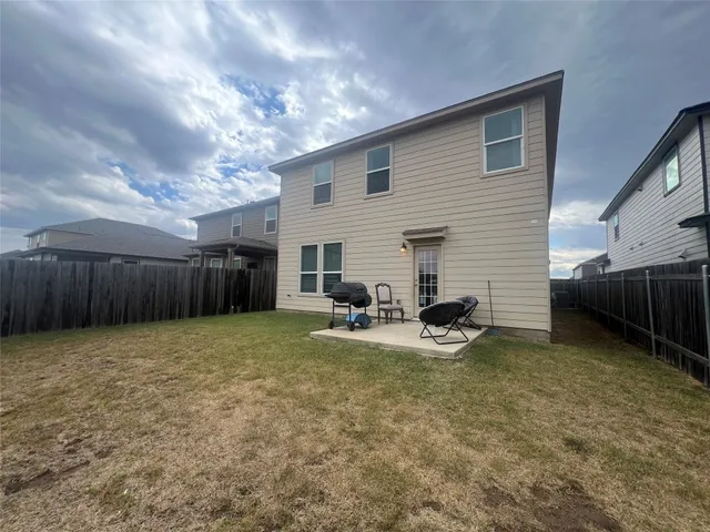 a view of a backyard with furniture
