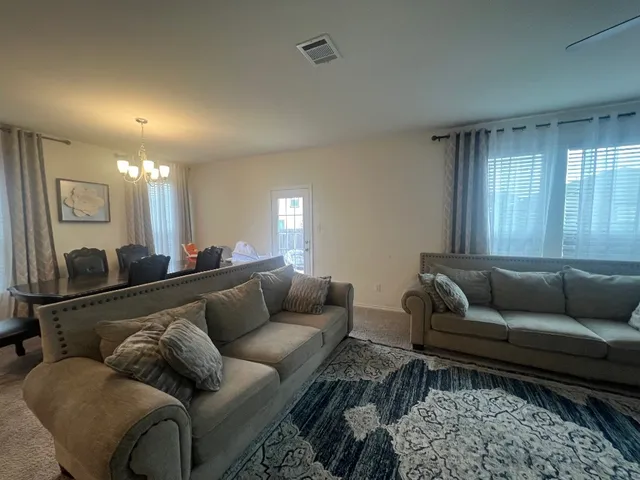 a living room with furniture and a couch