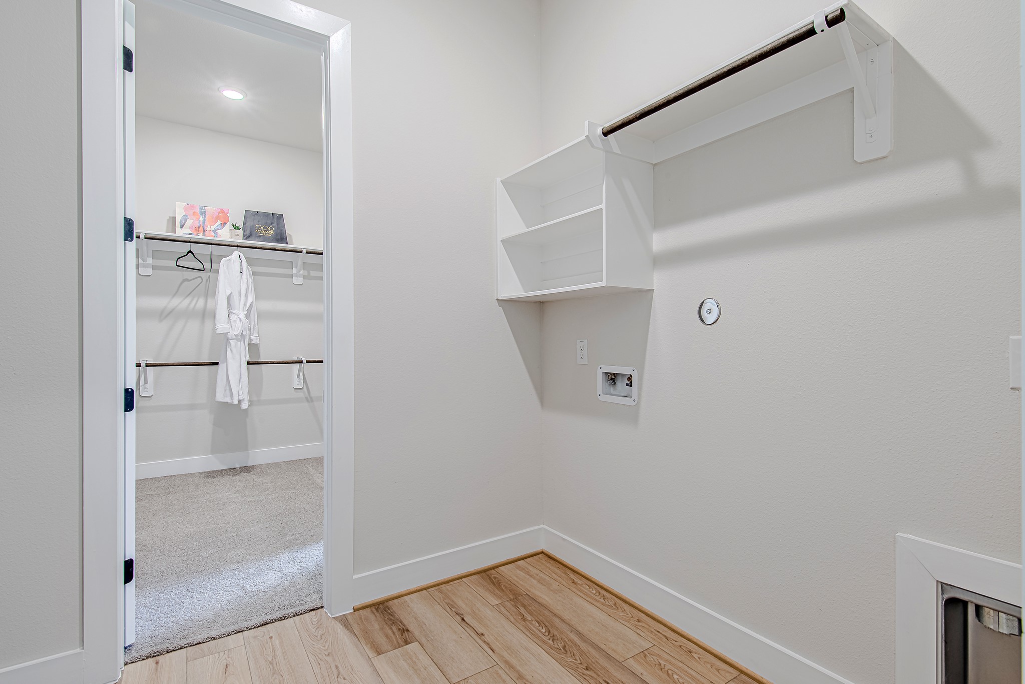141 Peninsula Point Drive Montgomery, TX 77356 - Photo 26 of 47 A unique layout connects the primary closet directly to the laundry room, adding ease to everyday living.