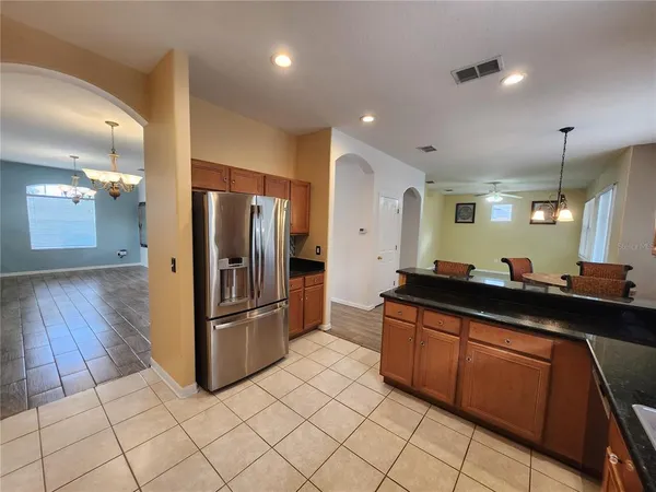 a kitchen with stainless steel appliances a refrigerator and a sink