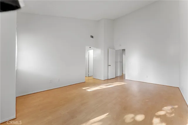 a view of an empty room with a fireplace